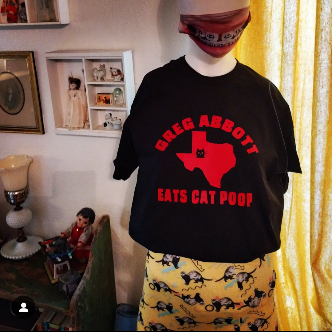 Greg Abbott Eats Cat Poop T-Shirt
